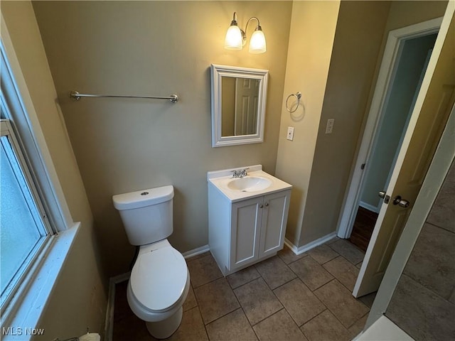 bathroom with tile patterned floors, vanity, and toilet