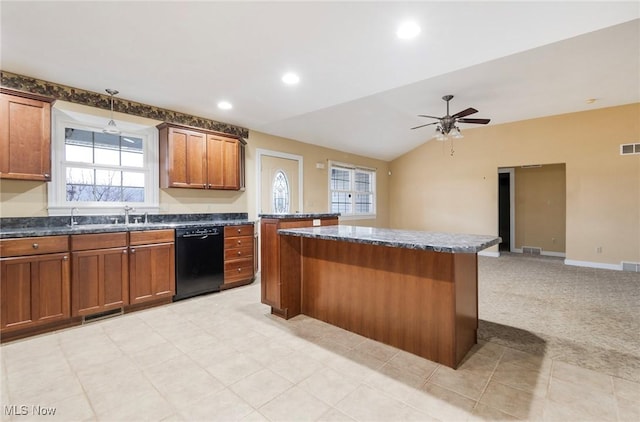 kitchen featuring lofted ceiling, sink, light carpet, dishwasher, and a kitchen island