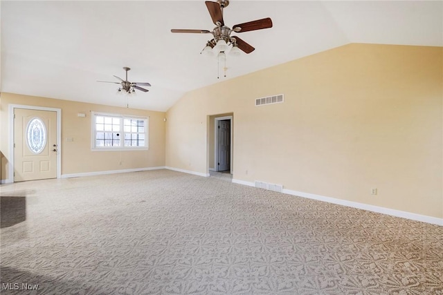 unfurnished living room featuring lofted ceiling, light carpet, and ceiling fan