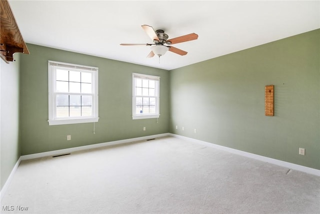 empty room with light carpet and ceiling fan