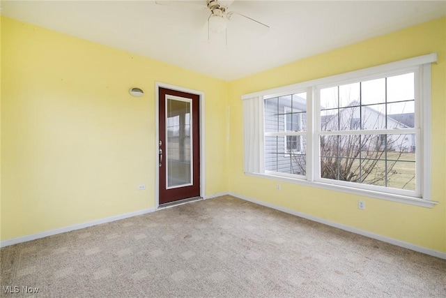 carpeted empty room with ceiling fan