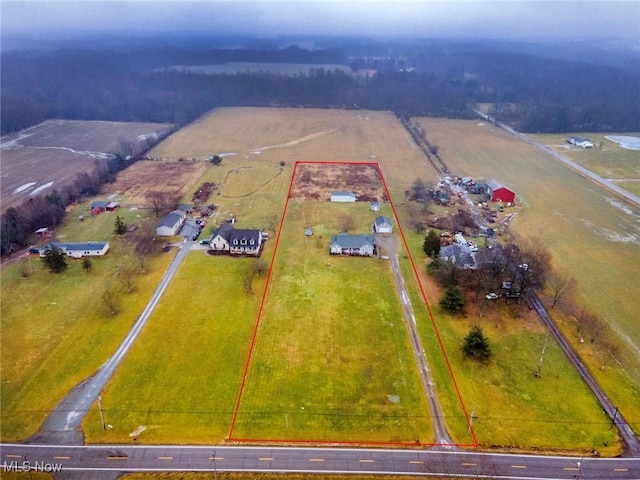 birds eye view of property featuring a rural view