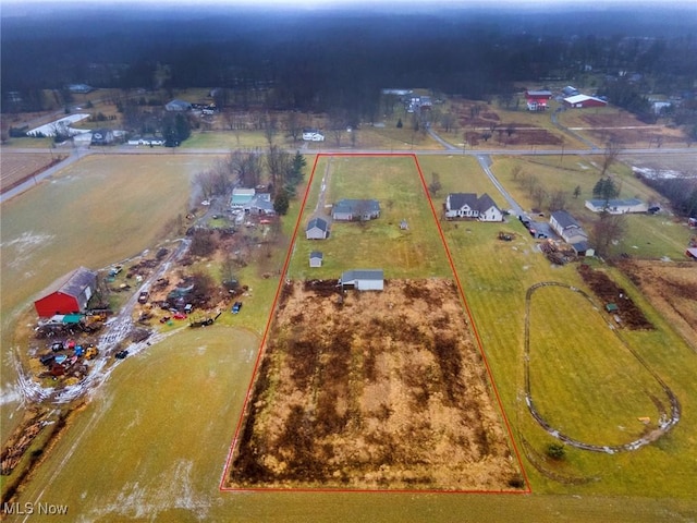 birds eye view of property featuring a rural view