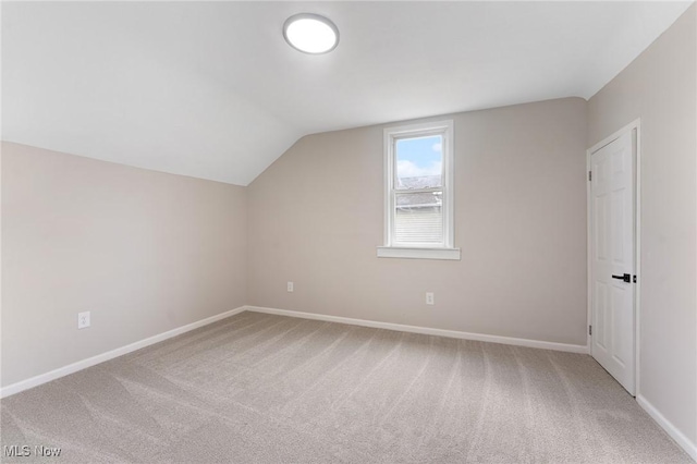 additional living space with lofted ceiling and carpet floors