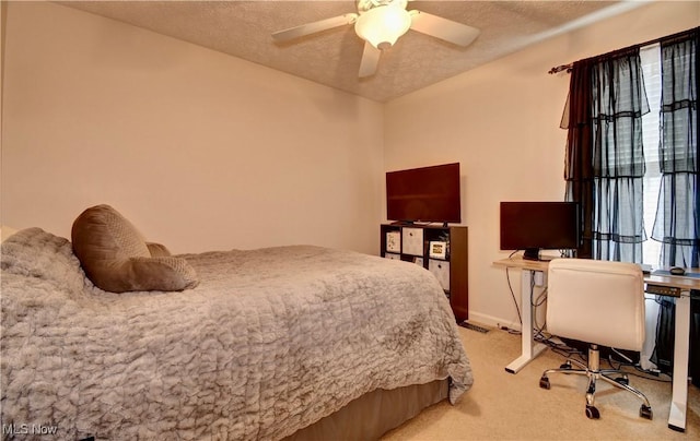 bedroom featuring light colored carpet and a textured ceiling