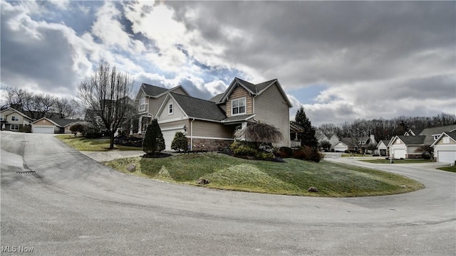 view of property exterior featuring a garage and a yard