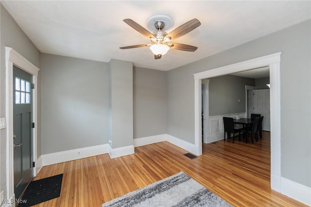 entrance foyer featuring ceiling fan and light wood-type flooring