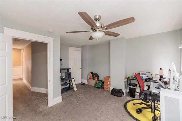 home office featuring ceiling fan and carpet flooring