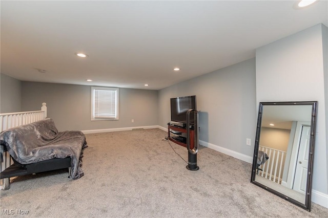 living area with light colored carpet