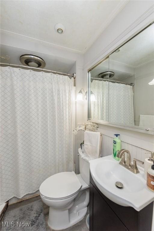 bathroom with vanity, a shower with curtain, and toilet