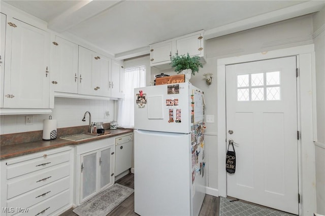 kitchen featuring white cabinetry, sink, dark hardwood / wood-style flooring, and white refrigerator