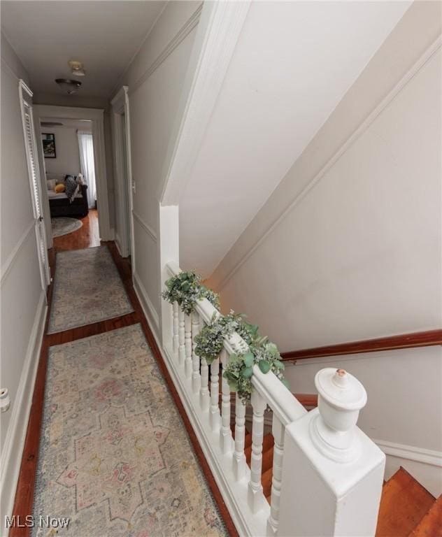 hallway with light hardwood / wood-style floors