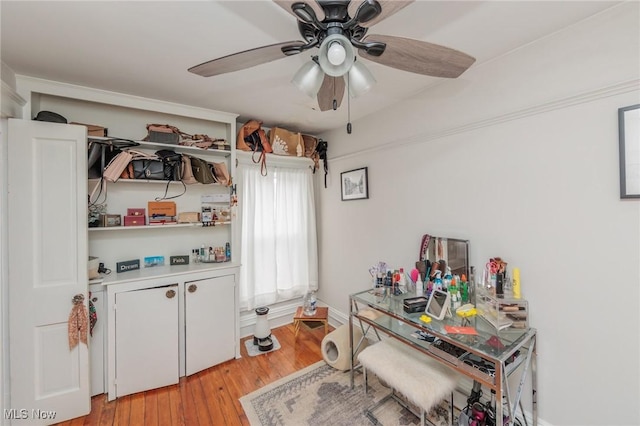 interior space with ceiling fan and light hardwood / wood-style floors