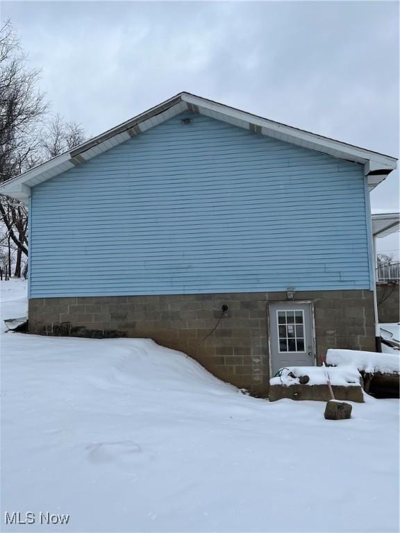 view of snow covered property