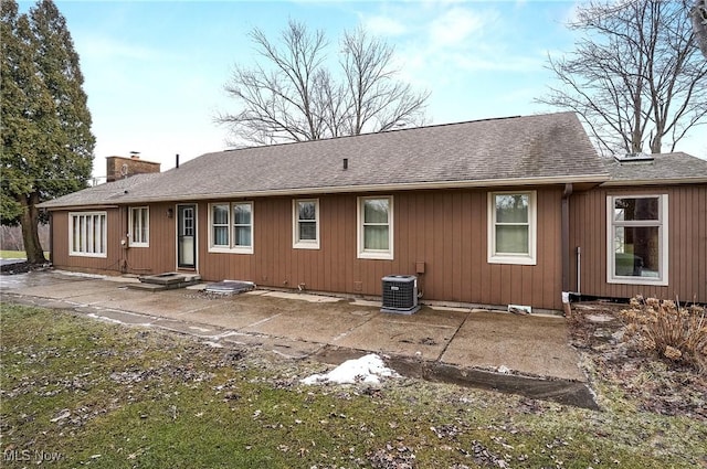 rear view of house featuring central AC and a patio area