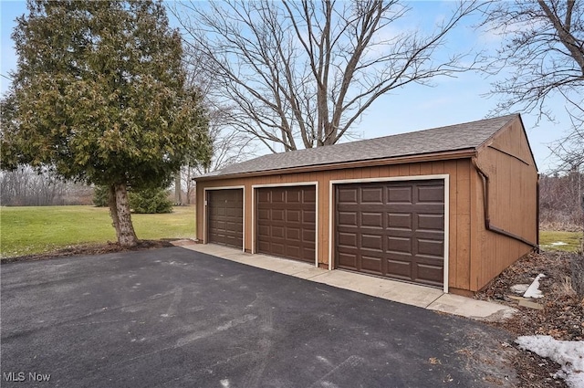 garage featuring a yard