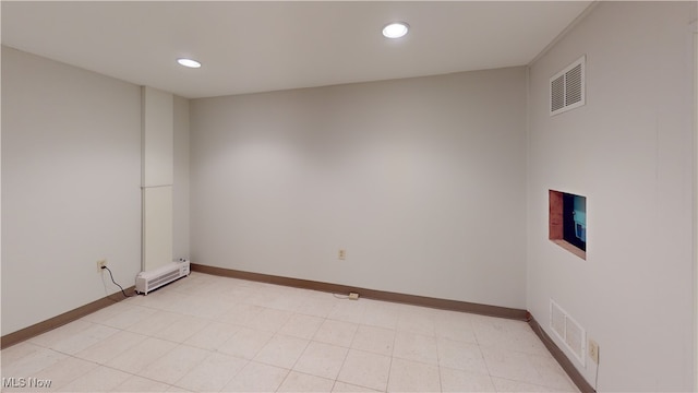 empty room with a baseboard heating unit