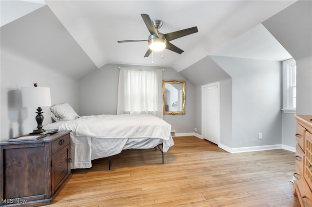 bedroom featuring vaulted ceiling, ceiling fan, and light hardwood / wood-style floors