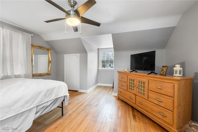 bedroom featuring vaulted ceiling, ceiling fan, and light hardwood / wood-style floors