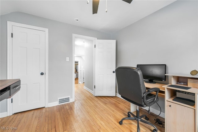 office space featuring vaulted ceiling, light hardwood / wood-style floors, and ceiling fan