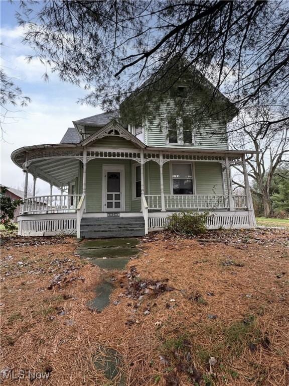 victorian home featuring a porch