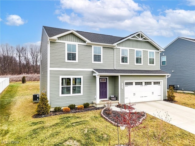 view of front of property featuring a garage and a front yard