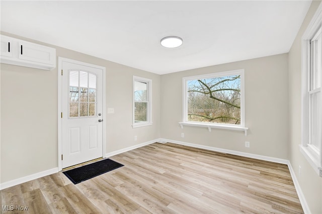 foyer entrance featuring light wood-type flooring