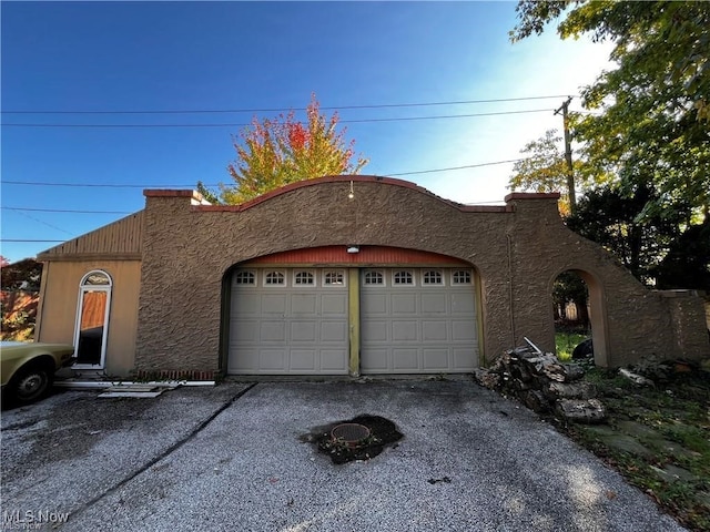 view of front of property with a garage