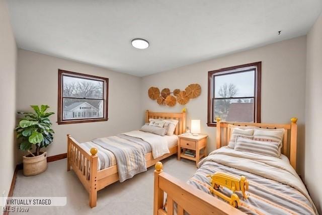 bedroom featuring light carpet