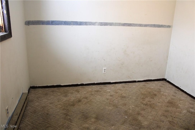 unfurnished room with carpet flooring