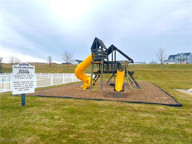 view of playground with a yard