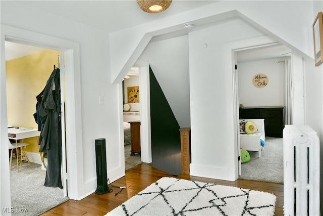 interior space with hardwood / wood-style flooring and radiator