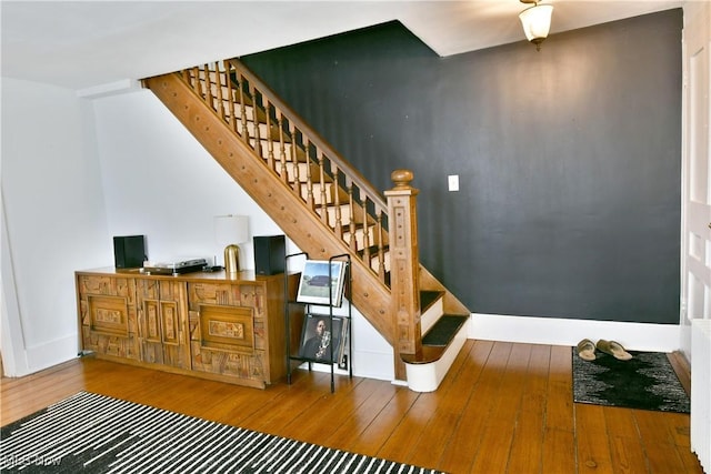 staircase featuring hardwood / wood-style floors