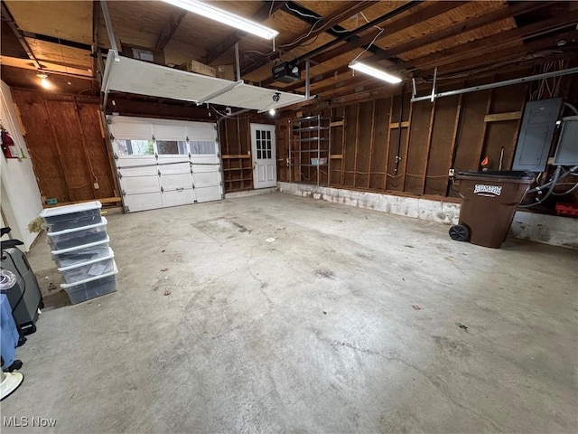 garage featuring a garage door opener and electric panel