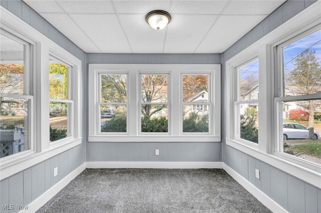 unfurnished sunroom with a paneled ceiling