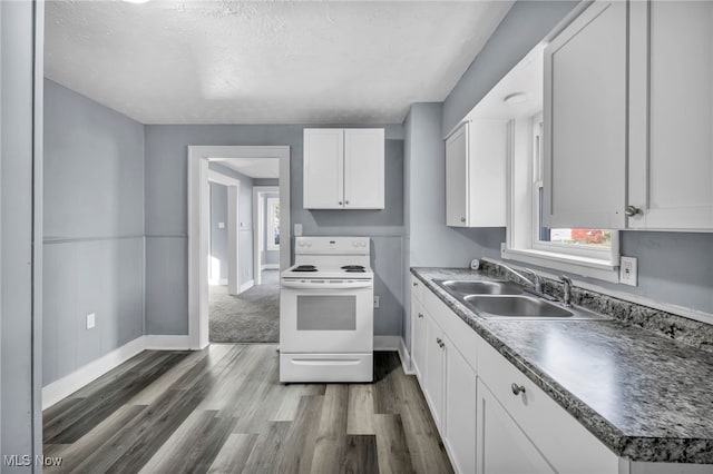 kitchen featuring sink, dark wood-type flooring, a textured ceiling, white cabinets, and white electric stove