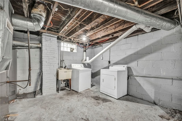 basement featuring sink and washing machine and clothes dryer