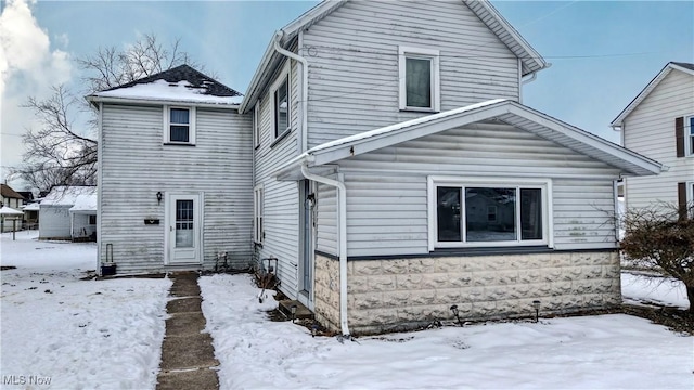 view of snow covered house