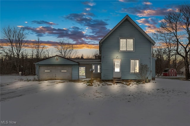 property exterior at dusk with a garage