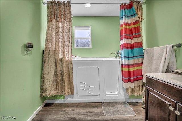 bathroom featuring wood-type flooring and vanity