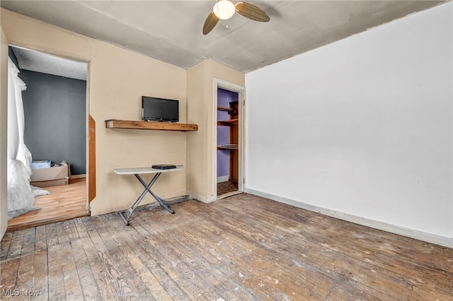 interior space with hardwood / wood-style flooring and ceiling fan