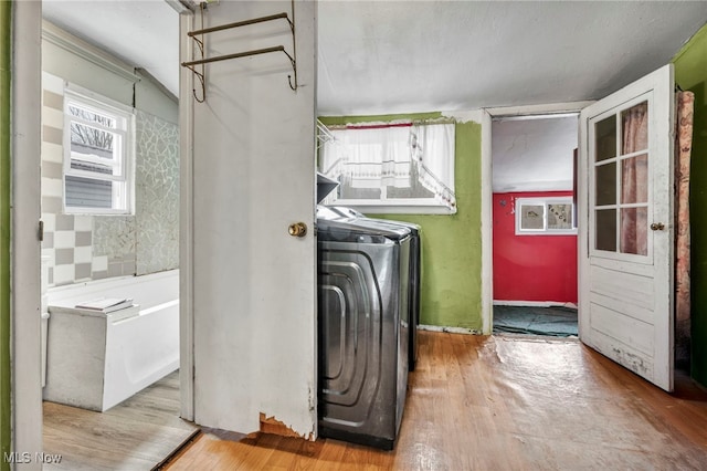 laundry room with light hardwood / wood-style flooring