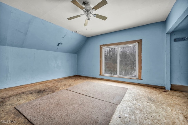 additional living space featuring lofted ceiling and ceiling fan