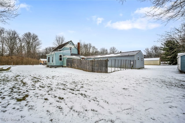 view of snow covered house