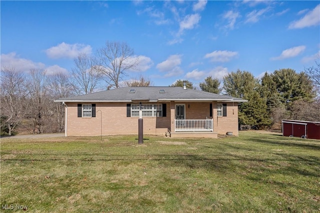 rear view of property with a porch and a yard