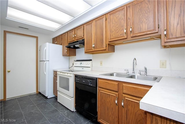 kitchen featuring white appliances and sink