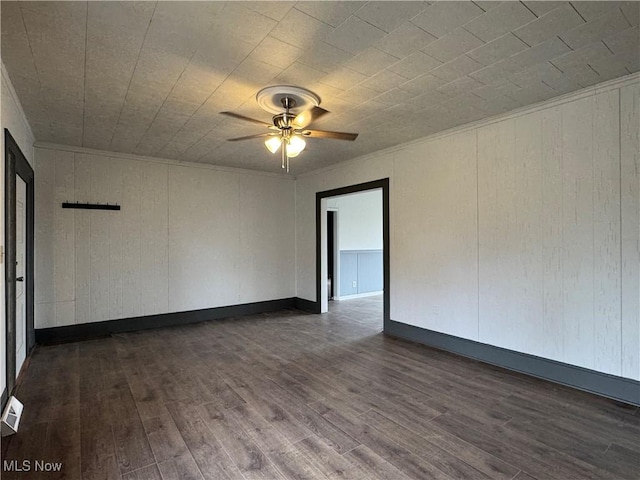 419 Saint Clair Ave, Cadiz, OH 43907 - spare room featuring ceiling fan, dark wood-type flooring, and crown molding