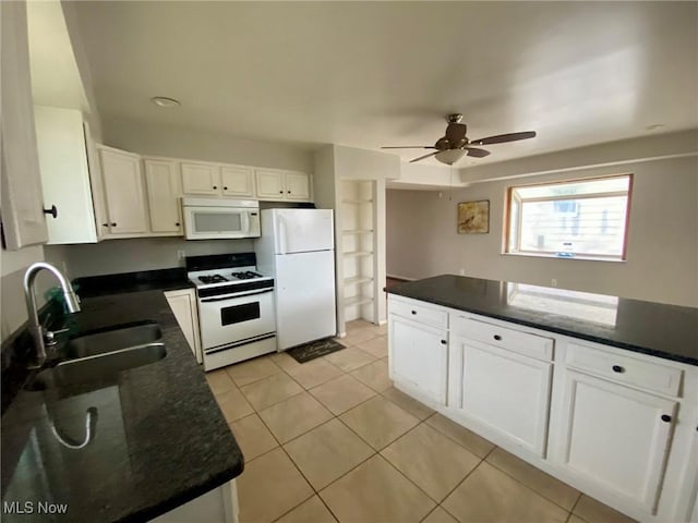 kitchen featuring sink, white cabinets, light tile patterned floors, ceiling fan, and white appliances