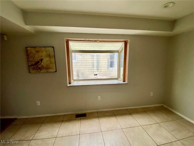 view of tiled spare room