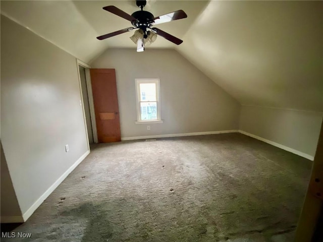 bonus room with lofted ceiling, carpet, and ceiling fan